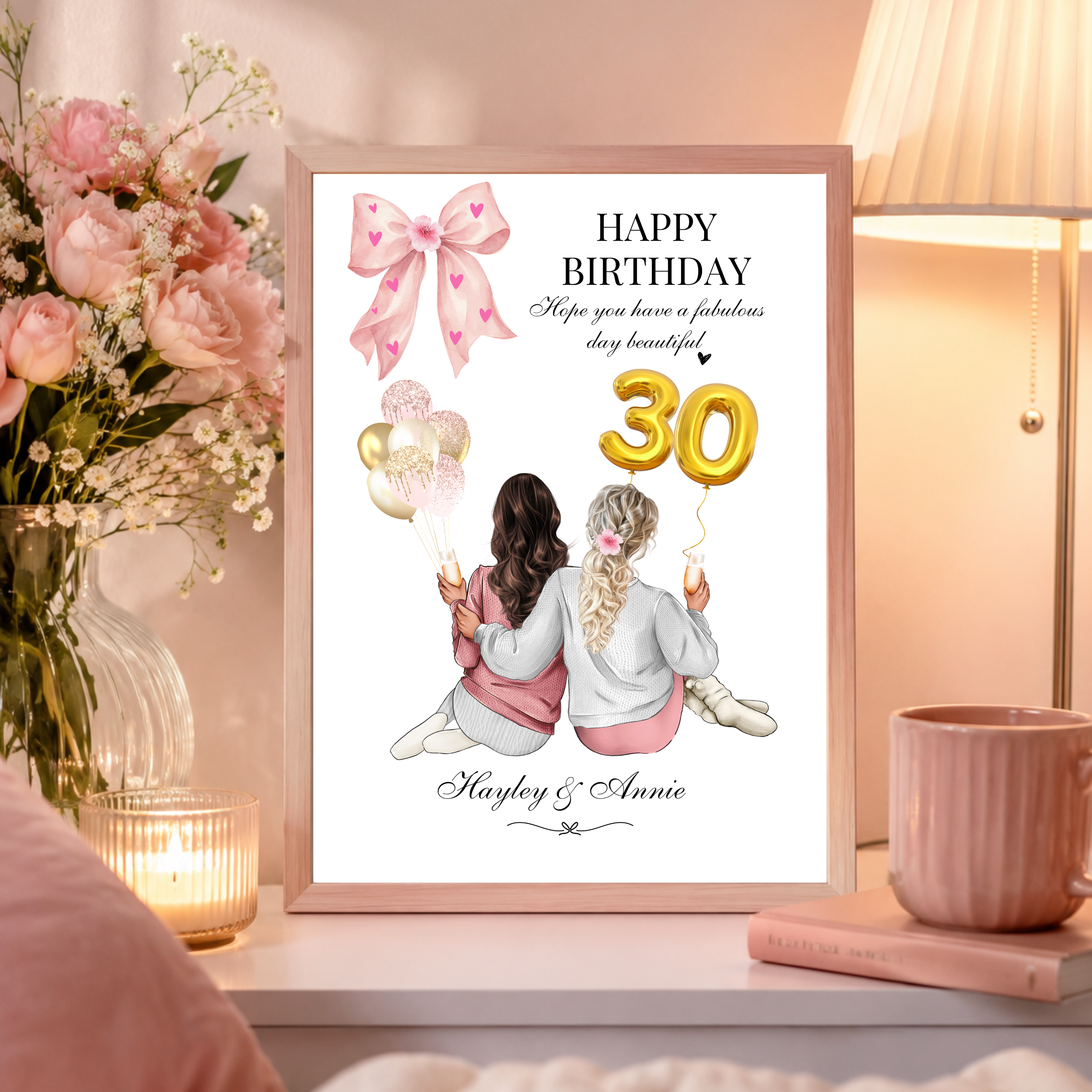 Personalised best friends birthday print with customisable hairstyles, outfits, and drinks, showcasing pink and gold themed age number balloons in a modern frame within a feminine home setting..