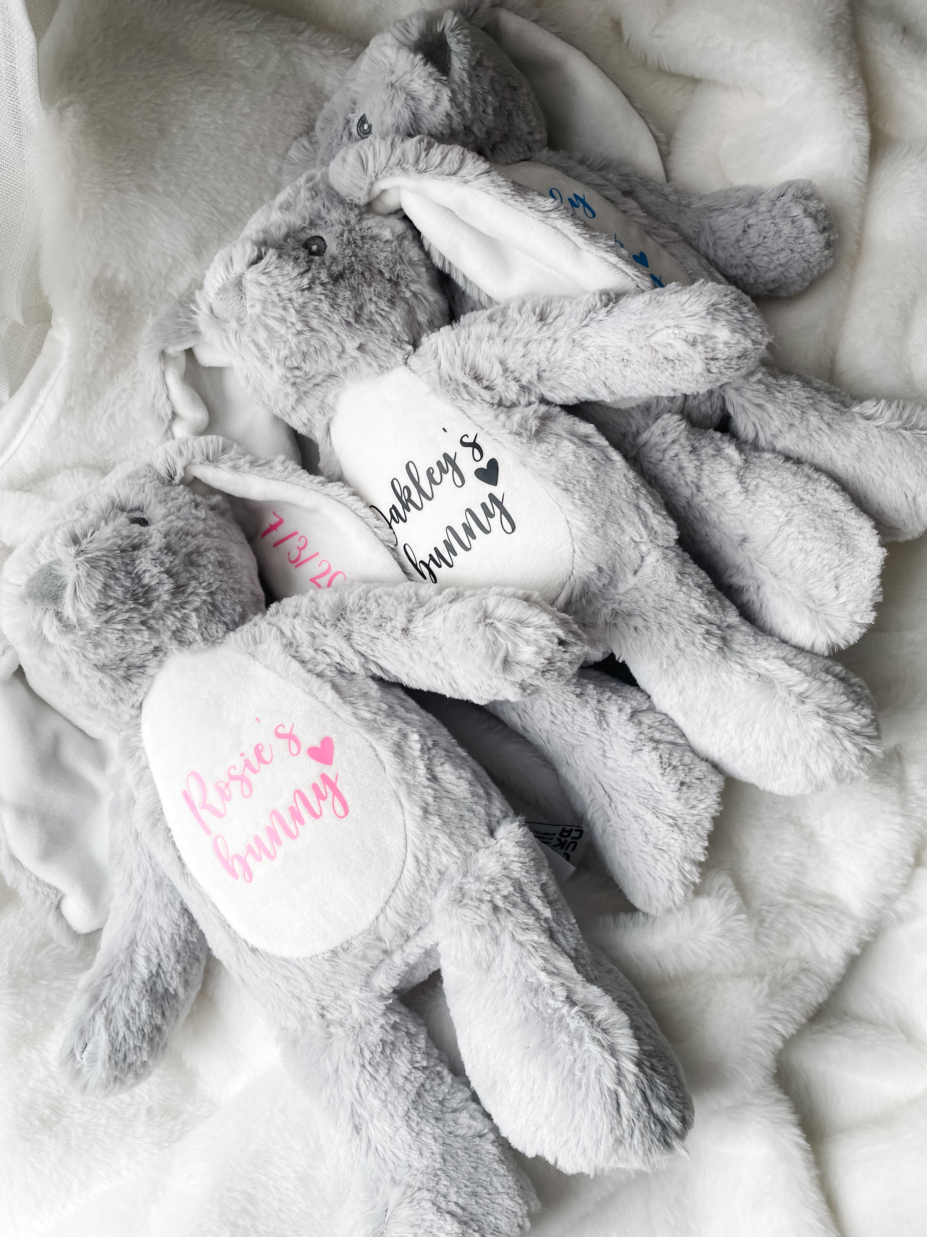 Three personalised bunny dog toys with custom names and dates. Soft personalised dog toys and thoughtful puppy gifts.
