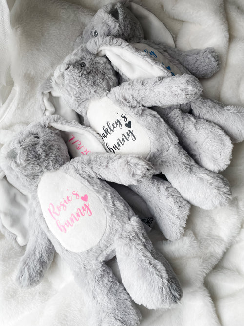 Three personalised bunny dog toys with custom names and dates. Soft personalised dog toys and thoughtful puppy gifts.