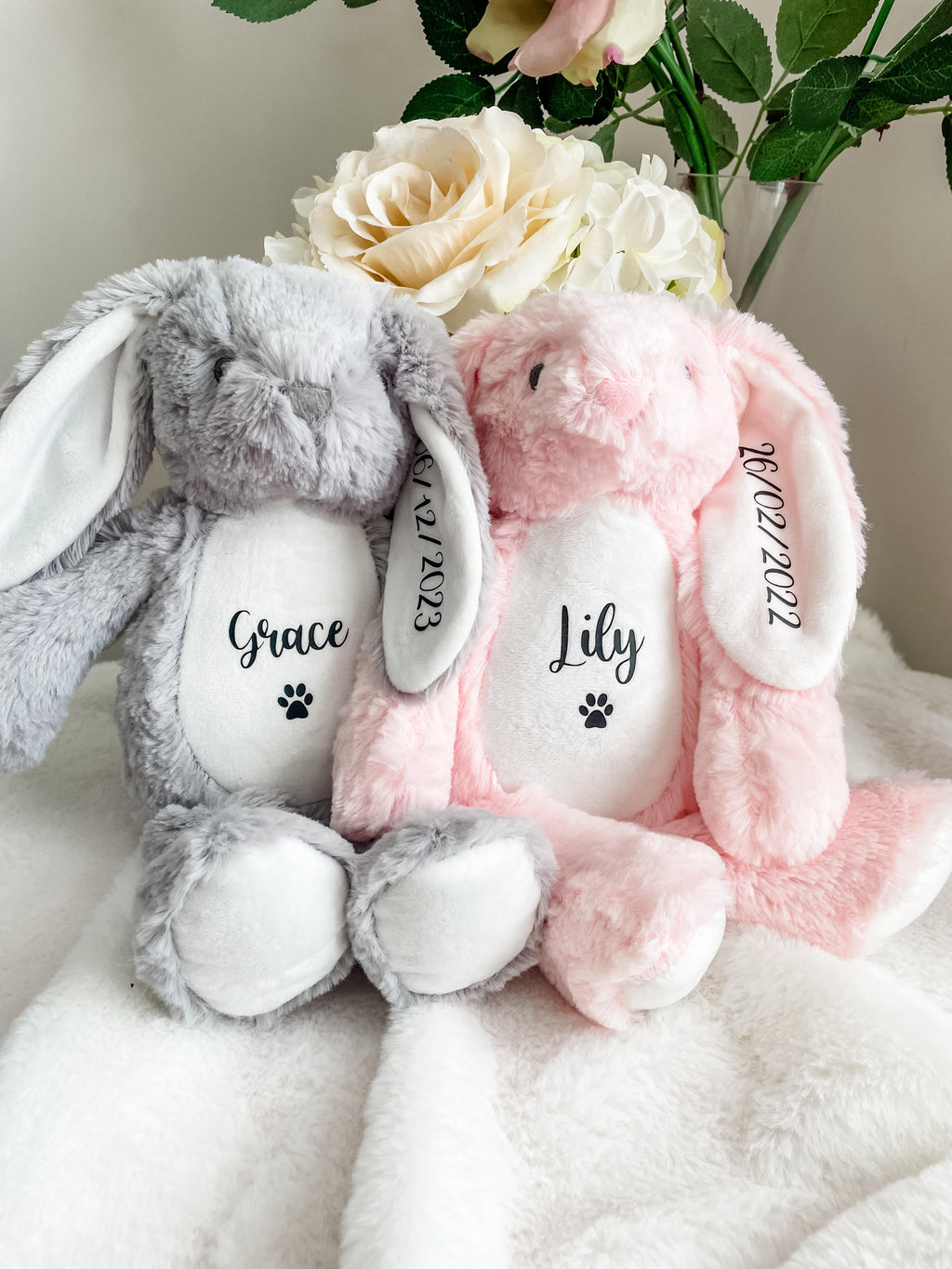 Grey and pink personalised birthday bunny toys customised with dog's name and date of birth.