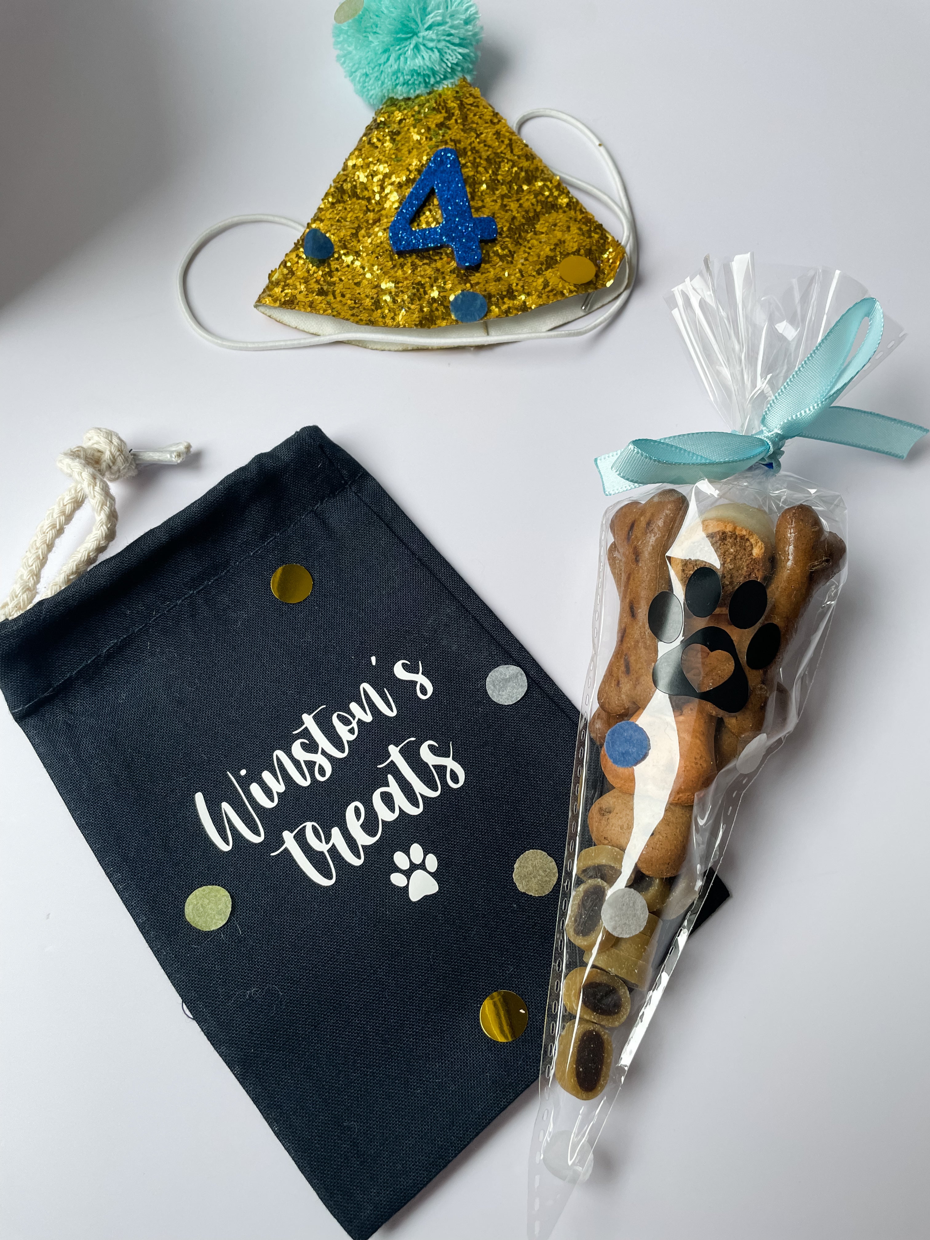 Personalised navy dog treat bag and birthday treat cone included inside deluxe dog birthday hamper.