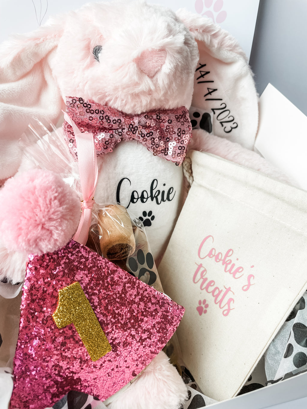 Luxury personalised dog birthday gift box with personalised bunny, treats and birthday accessories. 