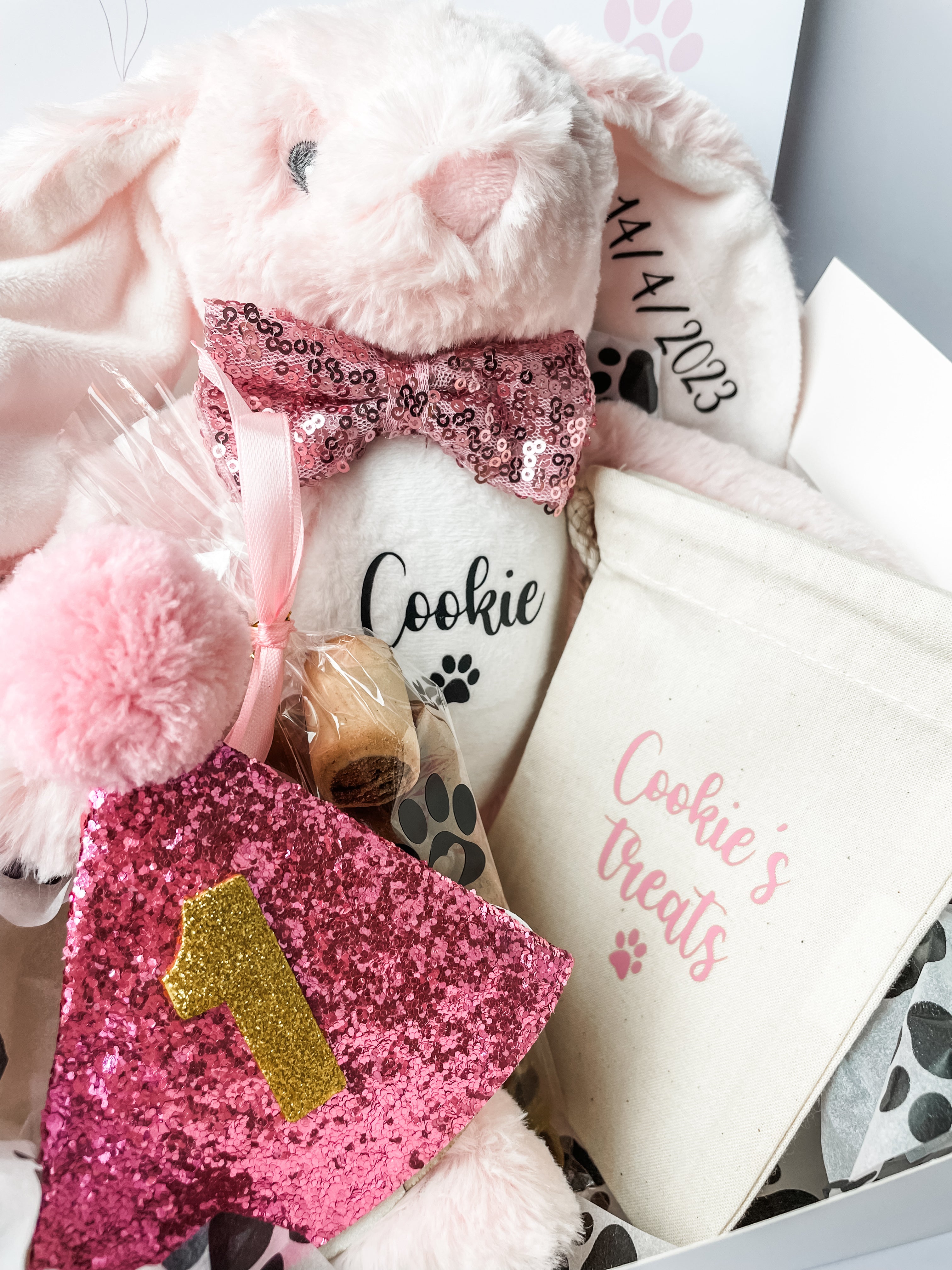 Luxury personalised dog birthday gift box with personalised bunny, treats and birthday accessories. 