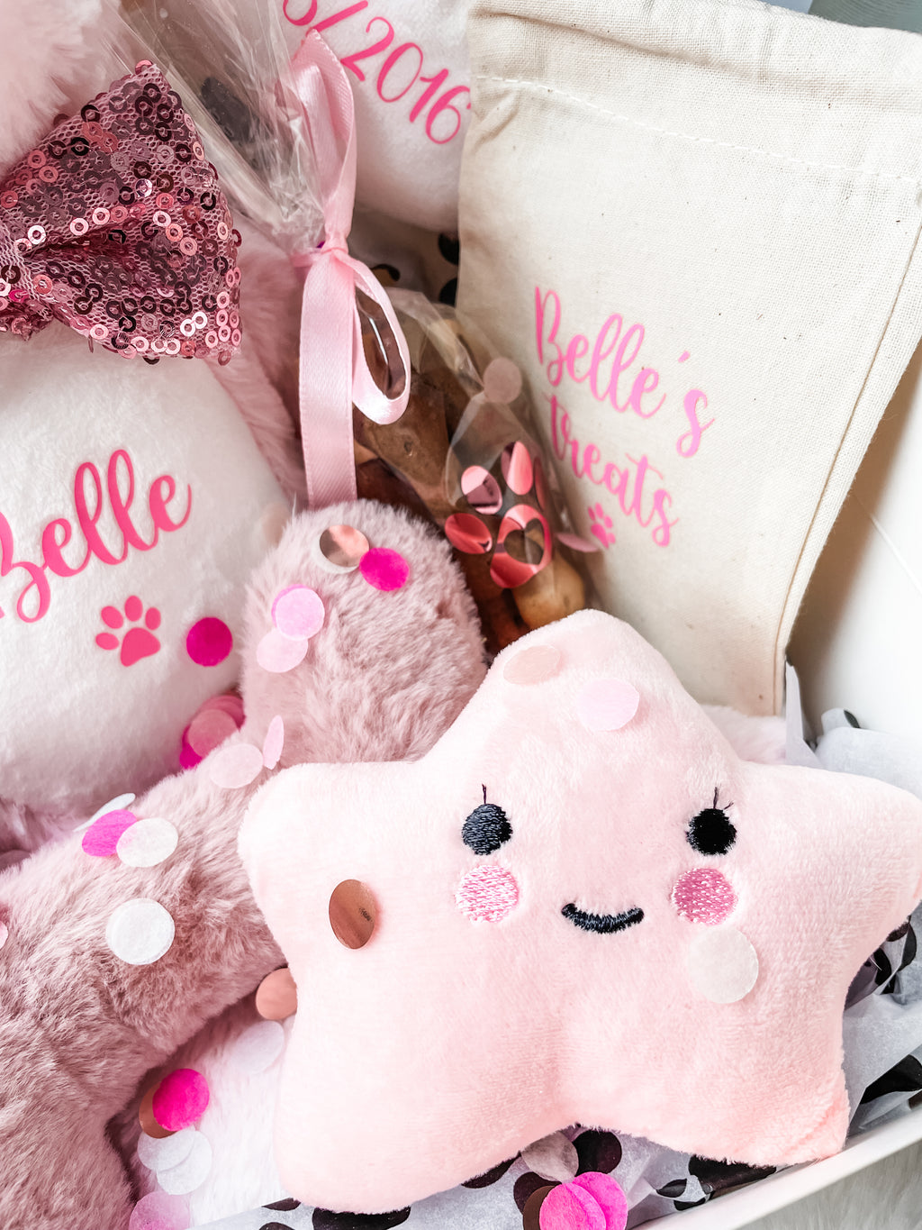 Personalised birthday hamper for dogs featuring plush star squeaker toy, soft bone squeaker toy, treat bag and treats. Perfect dog birthday gift.