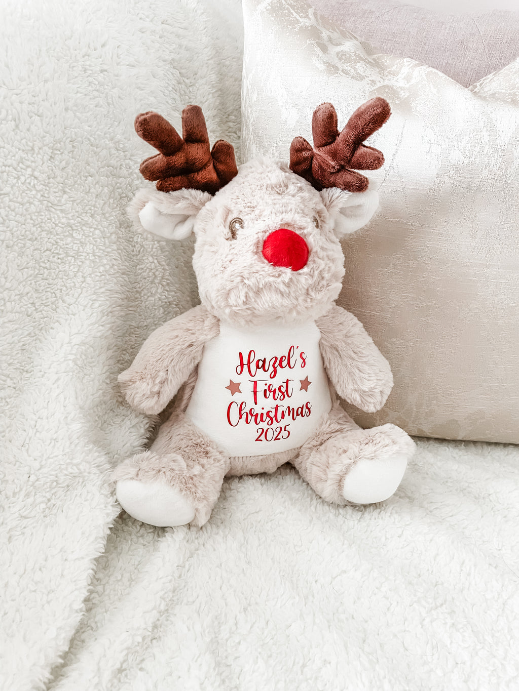 Personalised reindeer dog toy featuring custom name and 'First Christmas' text. First Christmas gift for puppies and dogs.