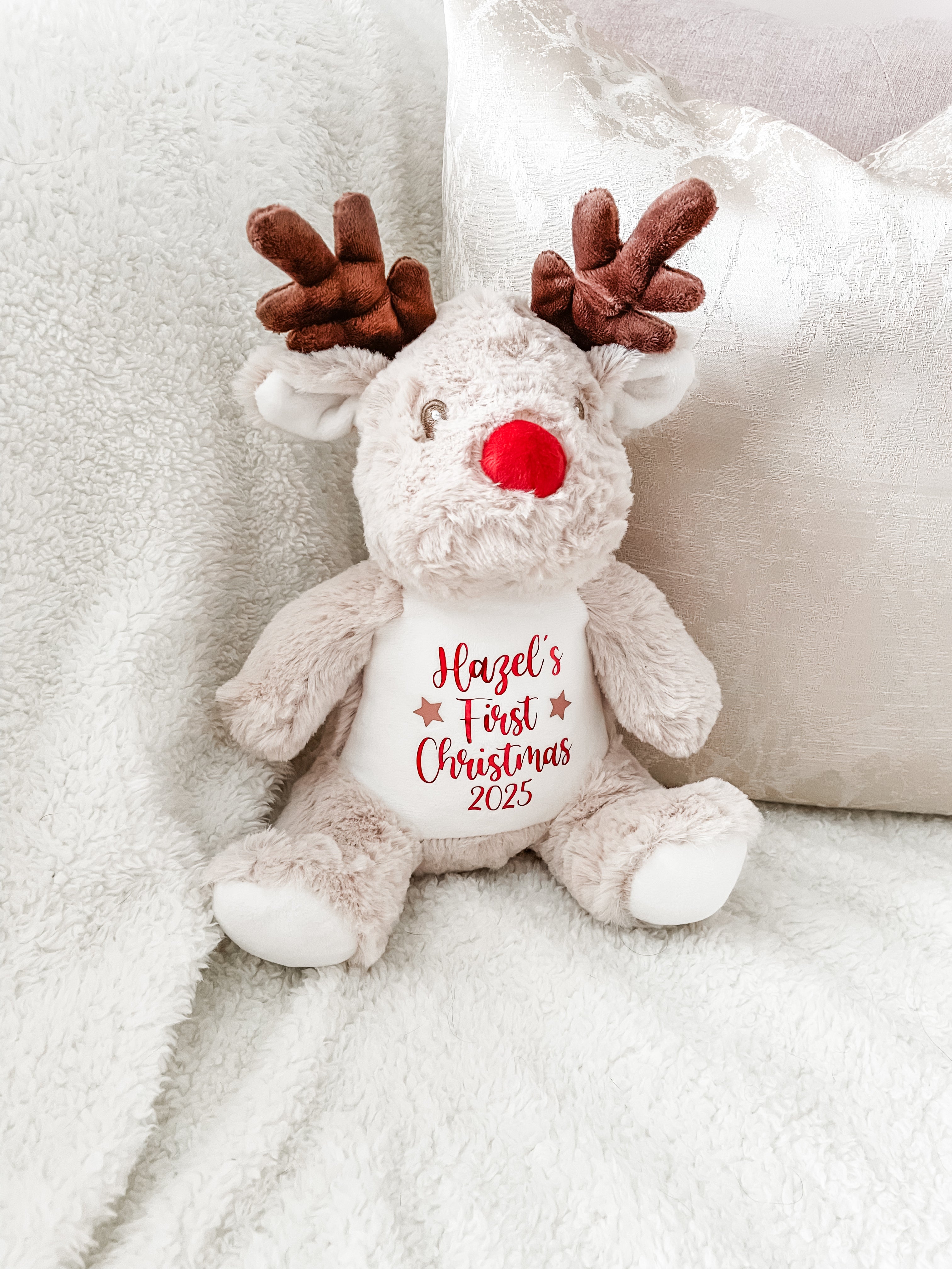 Personalised reindeer dog toy featuring custom name and 'First Christmas' text. First Christmas gift for puppies and dogs.