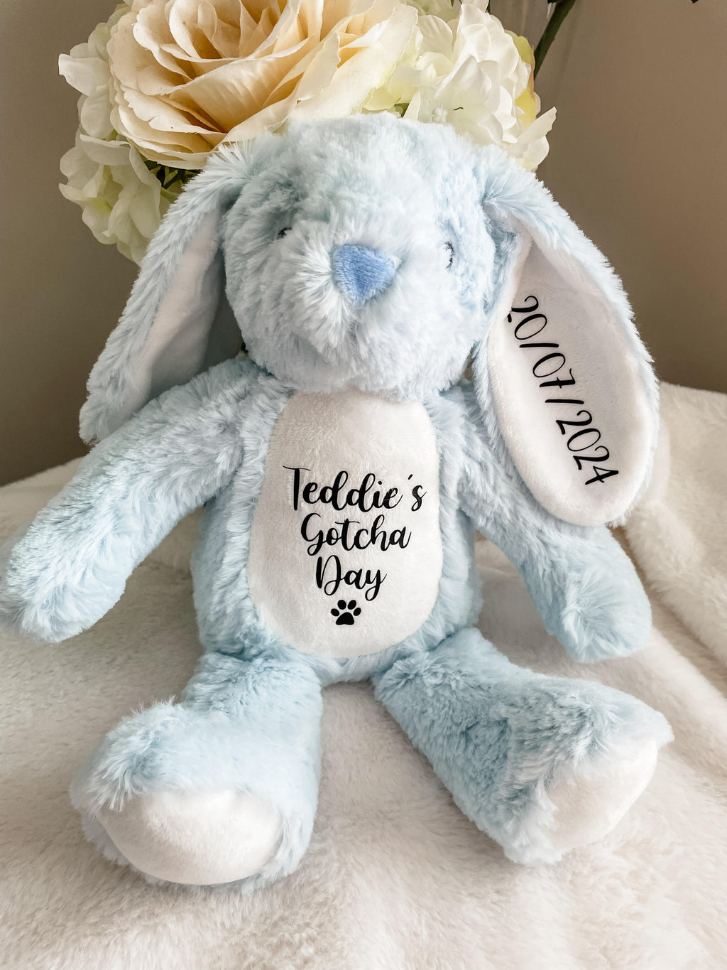 Blue personalised bunny Gotcha Day toy with dog's name and Gotcha Day date.