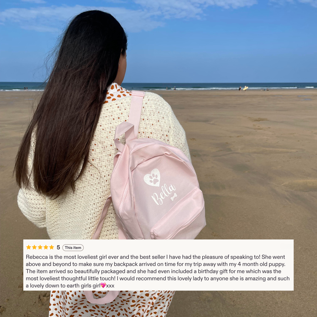 Customer carrying personalised pink dog backpack with five-star review. Custom dog walking backpack.