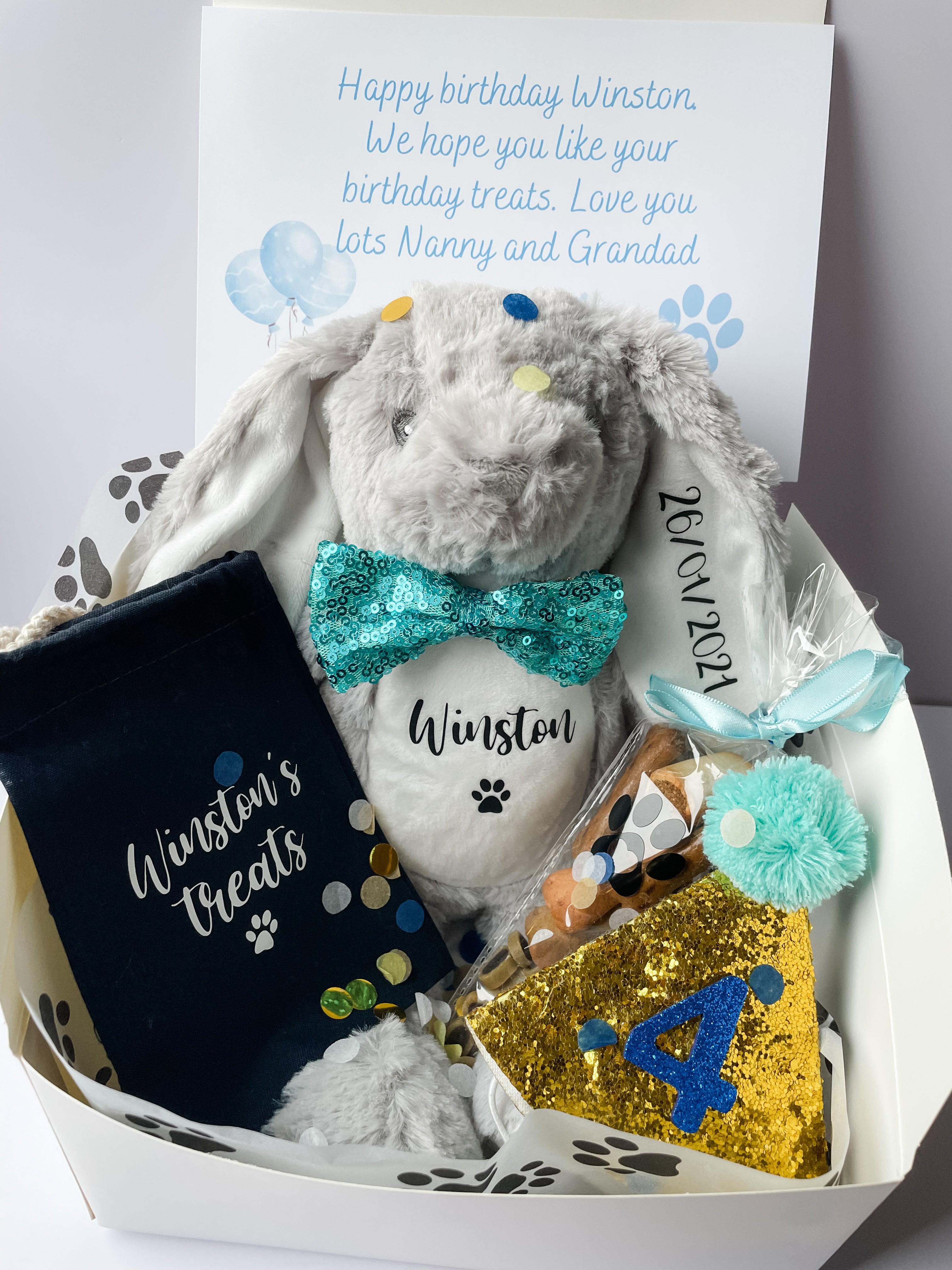 Personalised dog birthday hamper with bunny toy, birthday hat, treats and gift box. Luxury personalised dog birthday gift.