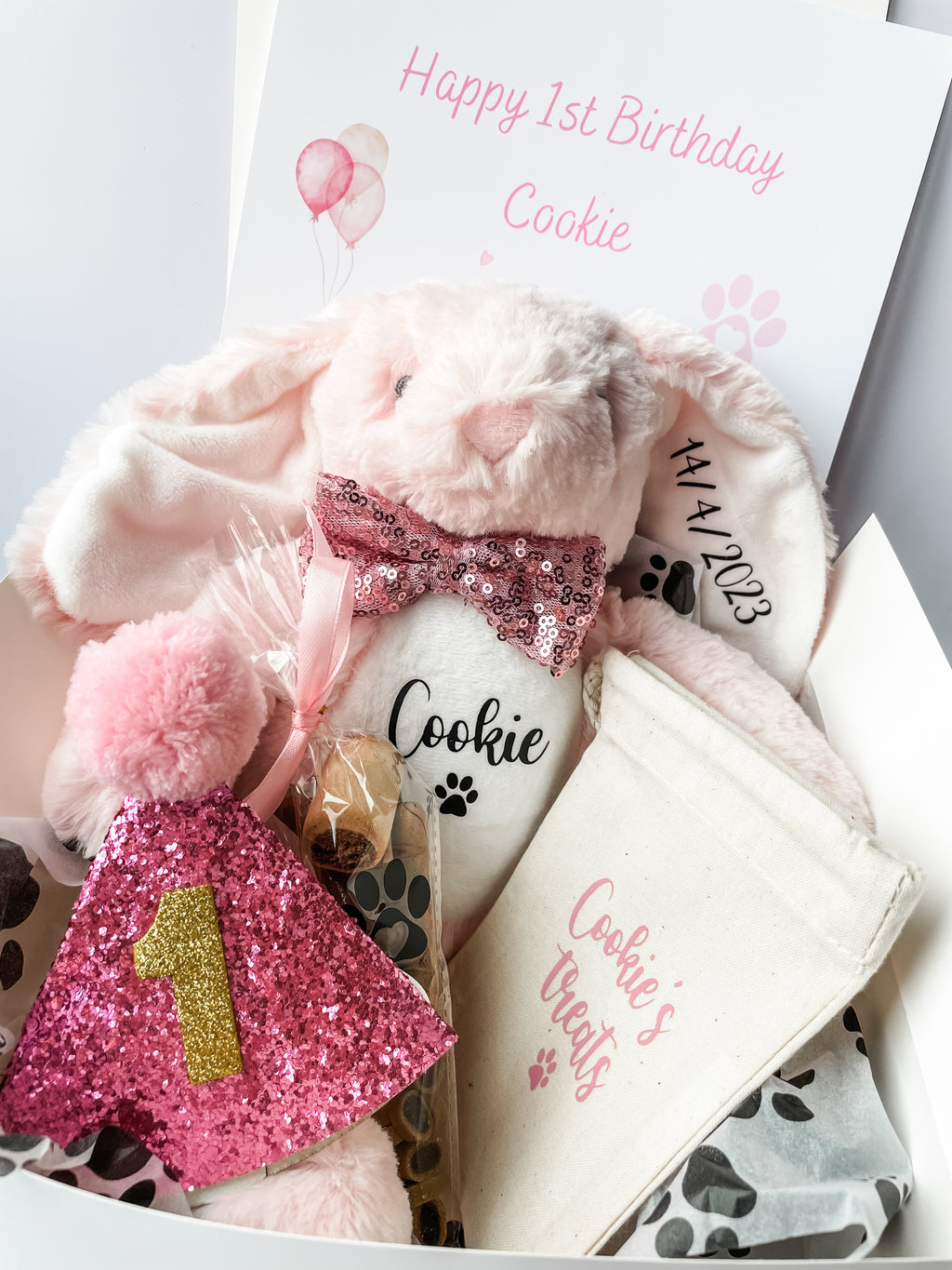 Personalised dog birthday hamper with bunny toy, birthday hat, treats and gift box. Luxury personalised dog birthday gift.