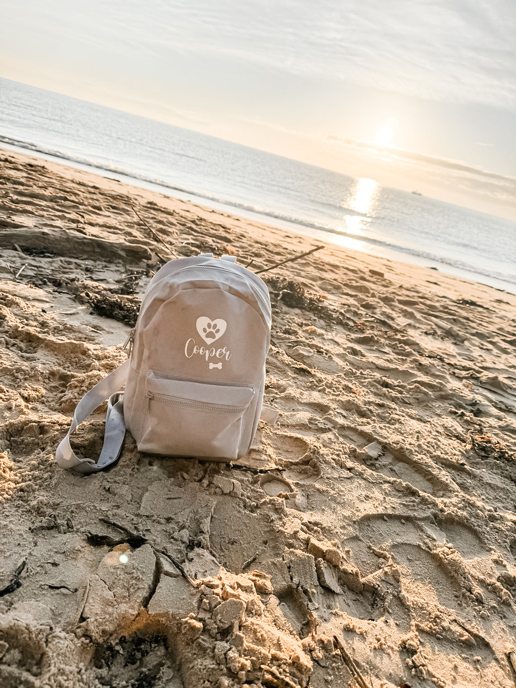 Grey personalised backpack for carrying dog essentials during walks and days out.