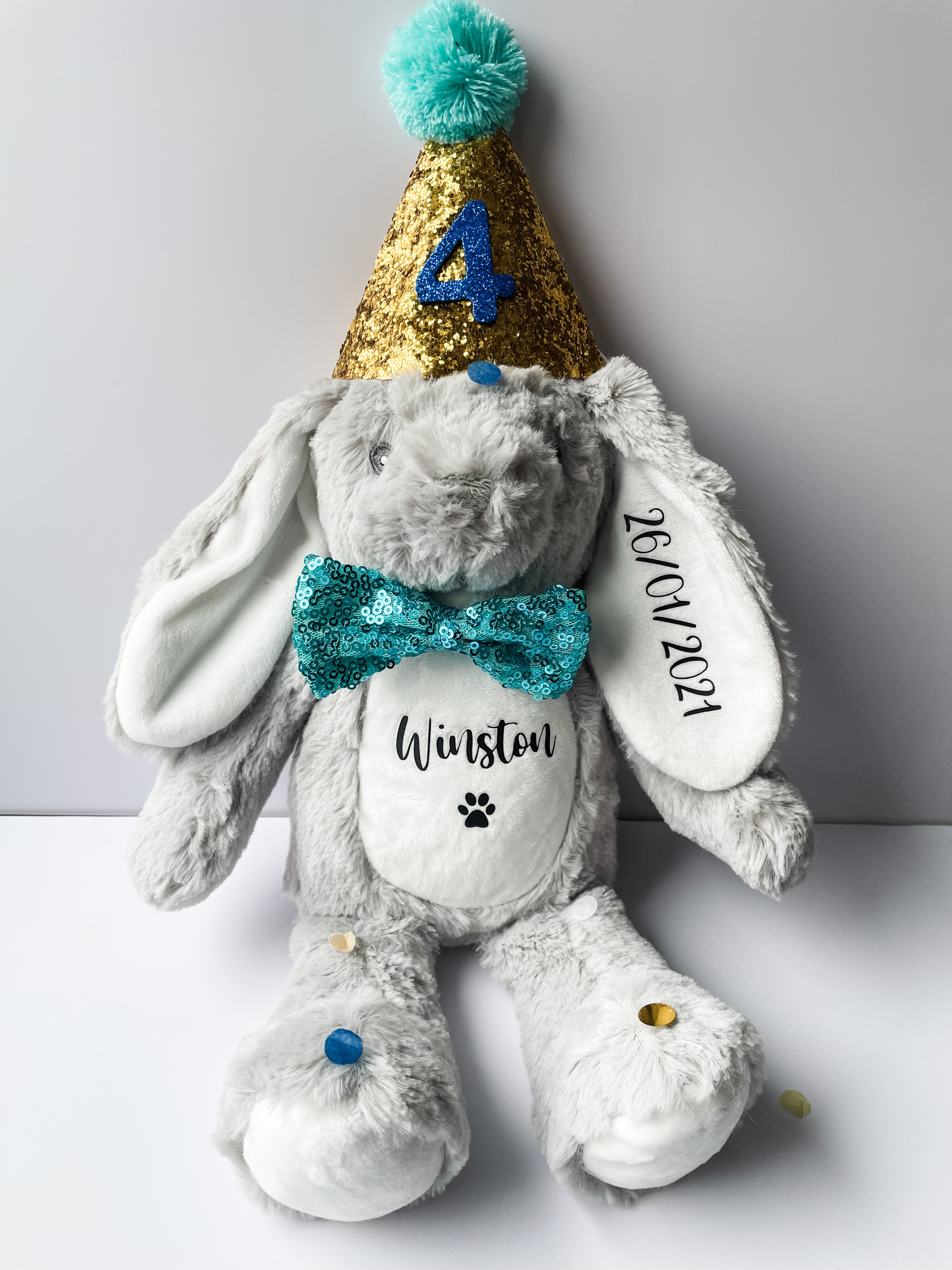 Personalised dog birthday bunny toy in grey with custom name and birthday date. Custom boy dog birthday toy.