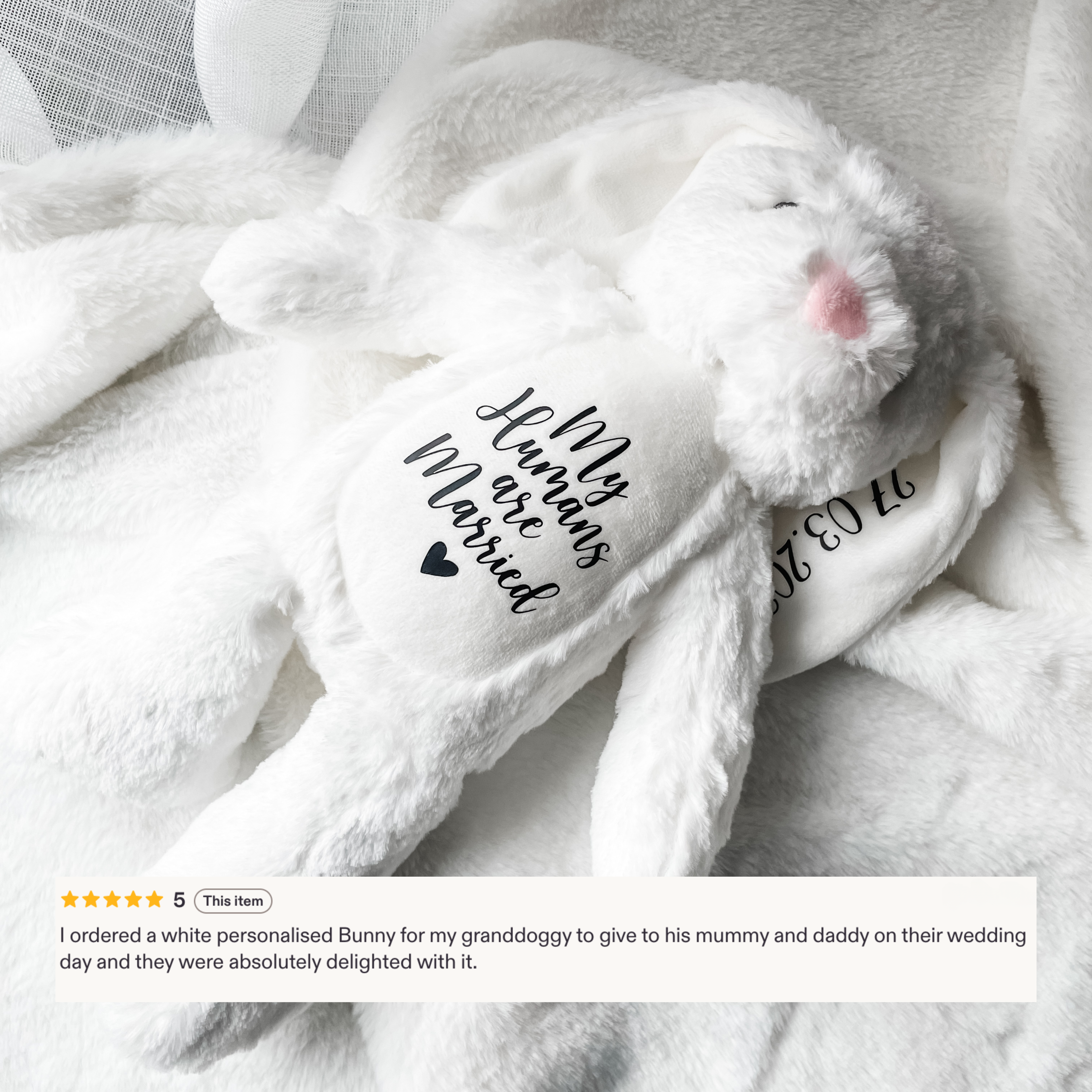 Personalised dog wedding gift bunny toy in white, styled in a home setting with the text detail 'my humans are married', with five-star review. Custom dog engagement gift.