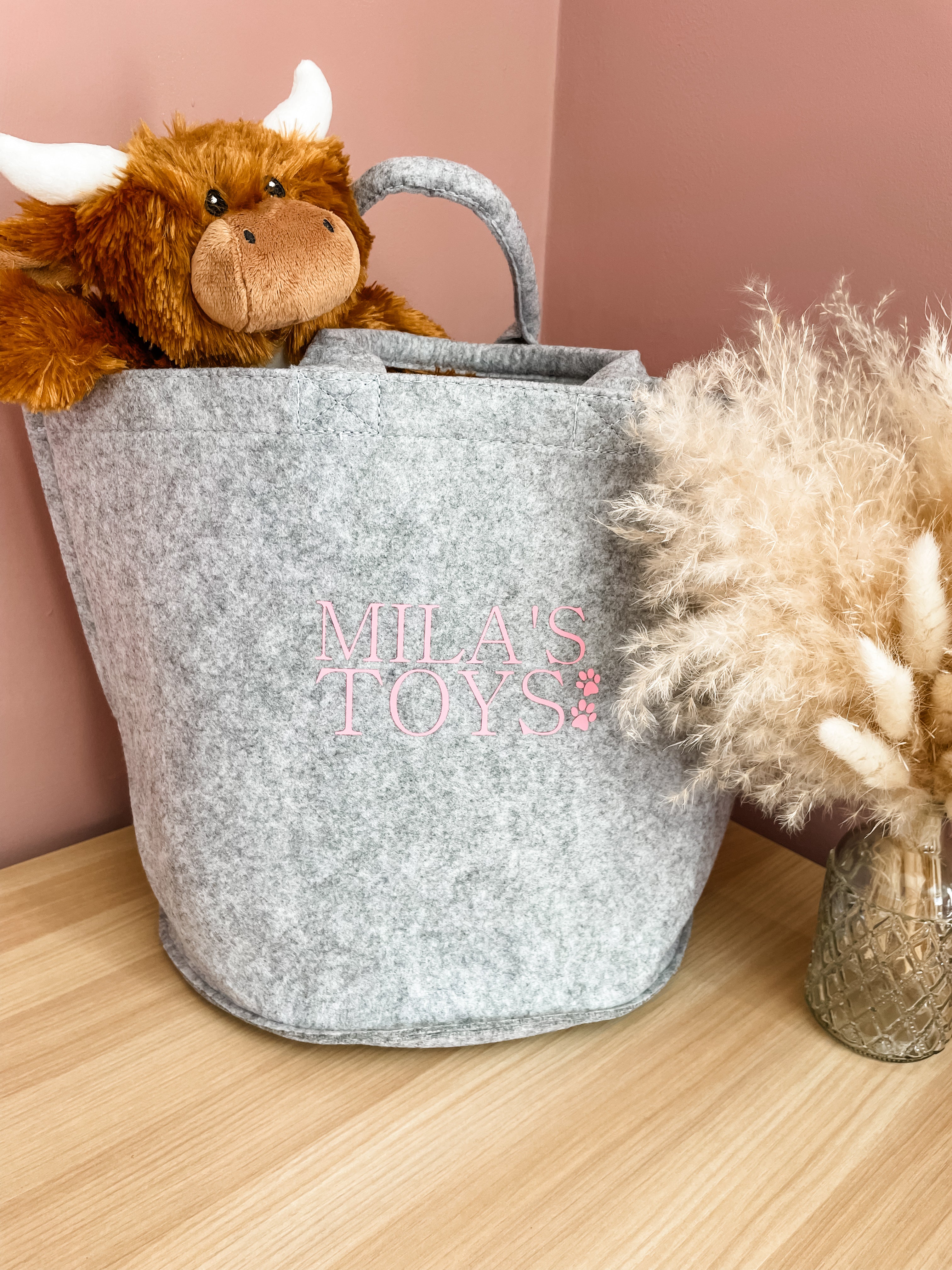 Grey personalised dog toy storage basket with custom name, perfect for keeping dog toys organised.