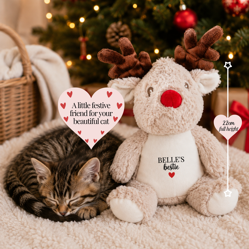 Personalised reindeer Christmas toy for cats measuring at 22cm tall, cat Christmas gift with a sleeping cat and festive friend message in a cosy Christmas home.