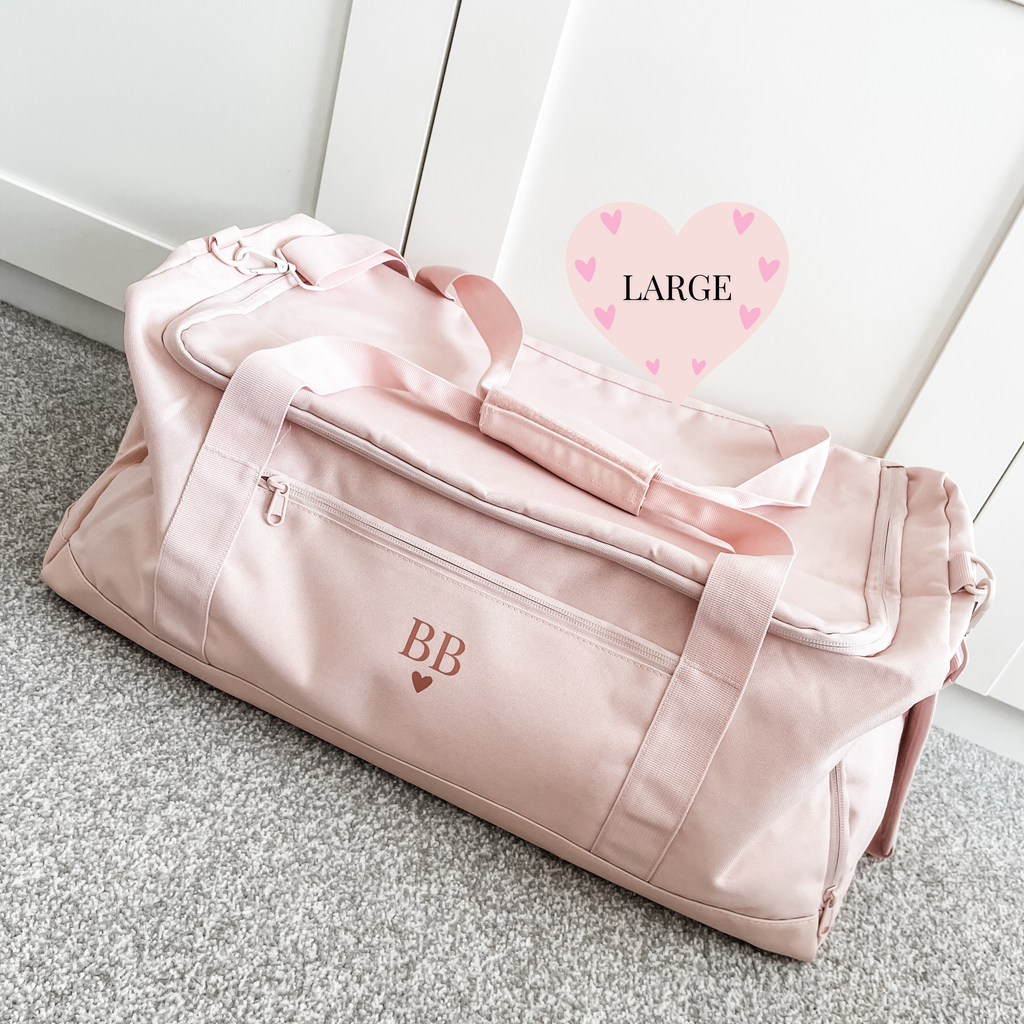 Personalised large travel duffle bag in pink with monogram initials, perfect for holidays, weekends away, gym and everyday use. Personalised gym bag for her.