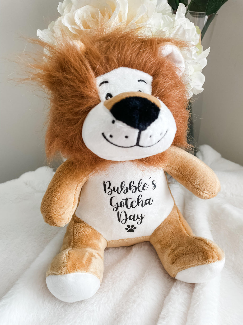 Personalised lion Gotcha Day dog toy customised with dog's name and Gotcha Day date.