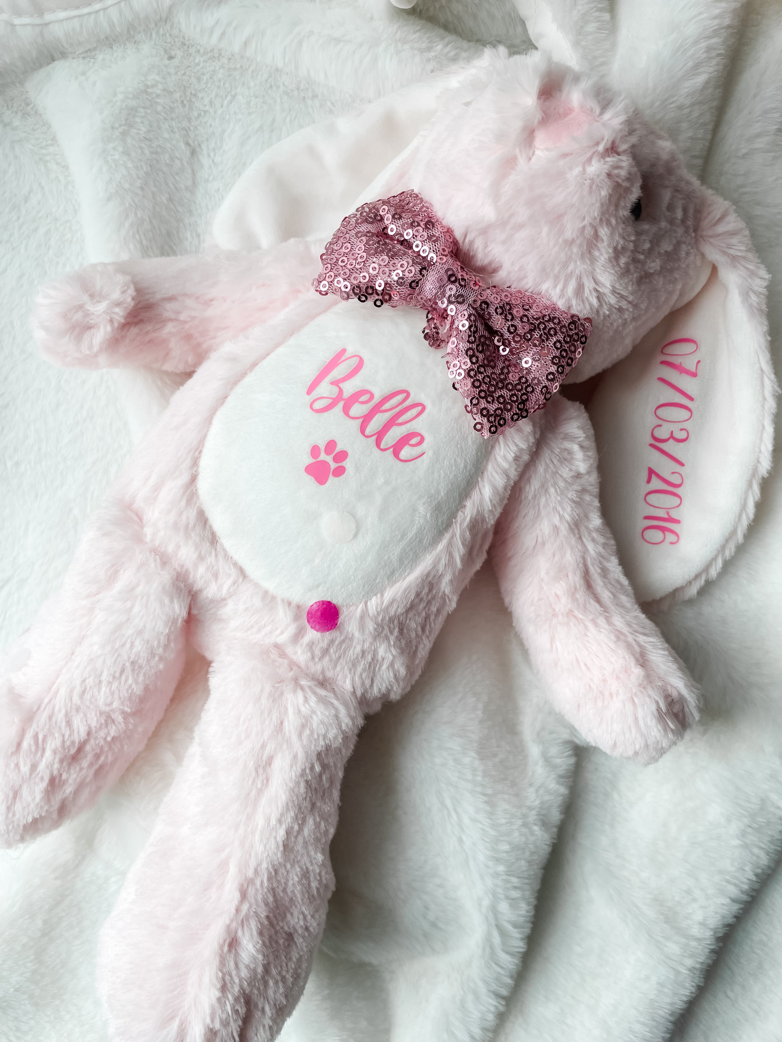 Soft personalised pink bunny dog toy with custom dog name and birthday date. Girl dog birthday keepsake and personalised dog gift.