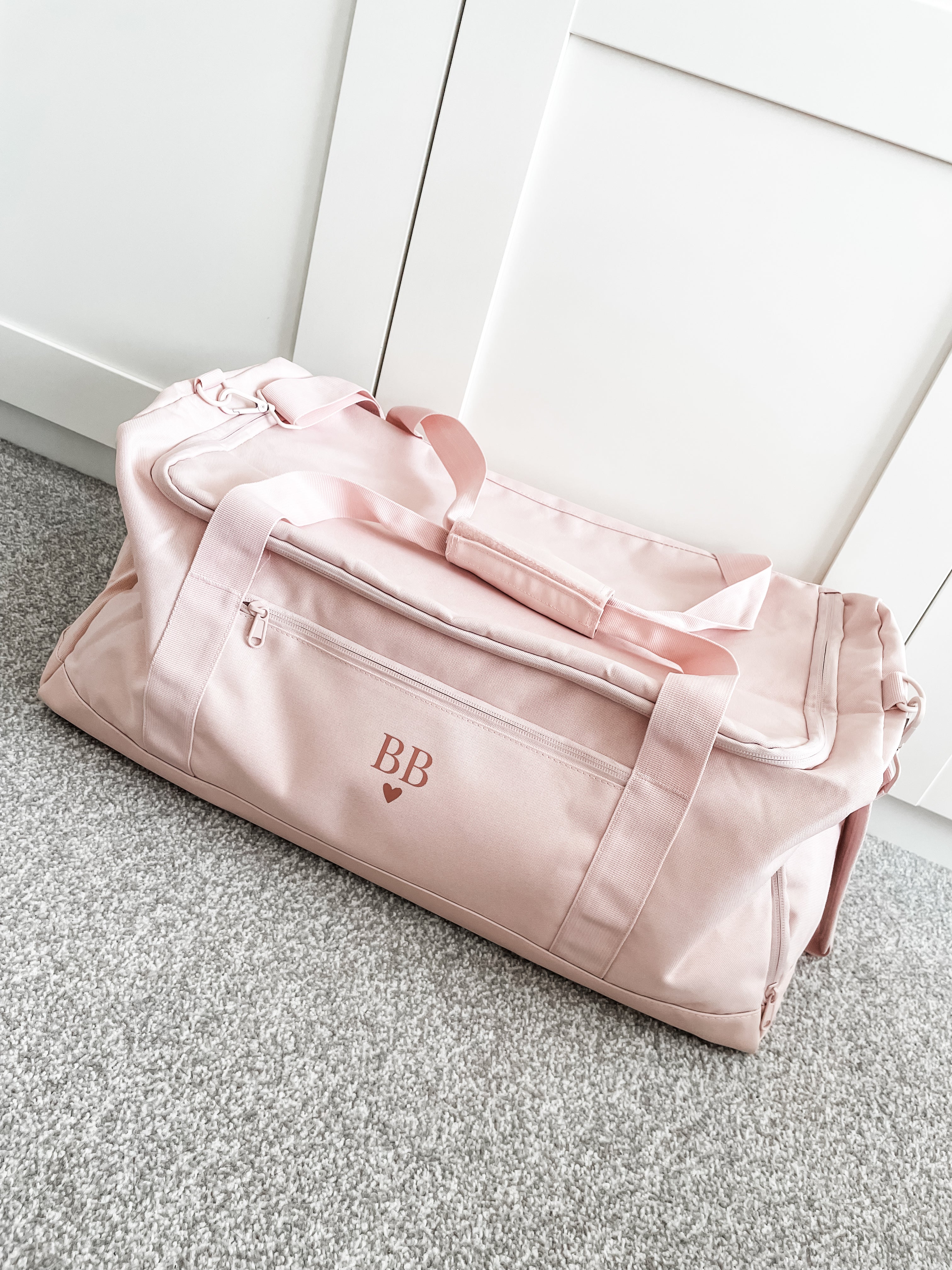 Personalised travel duffle bag in pink with monogram initials, perfect for holidays, weekends away, gym and everyday use. Personalised gym bag for her.