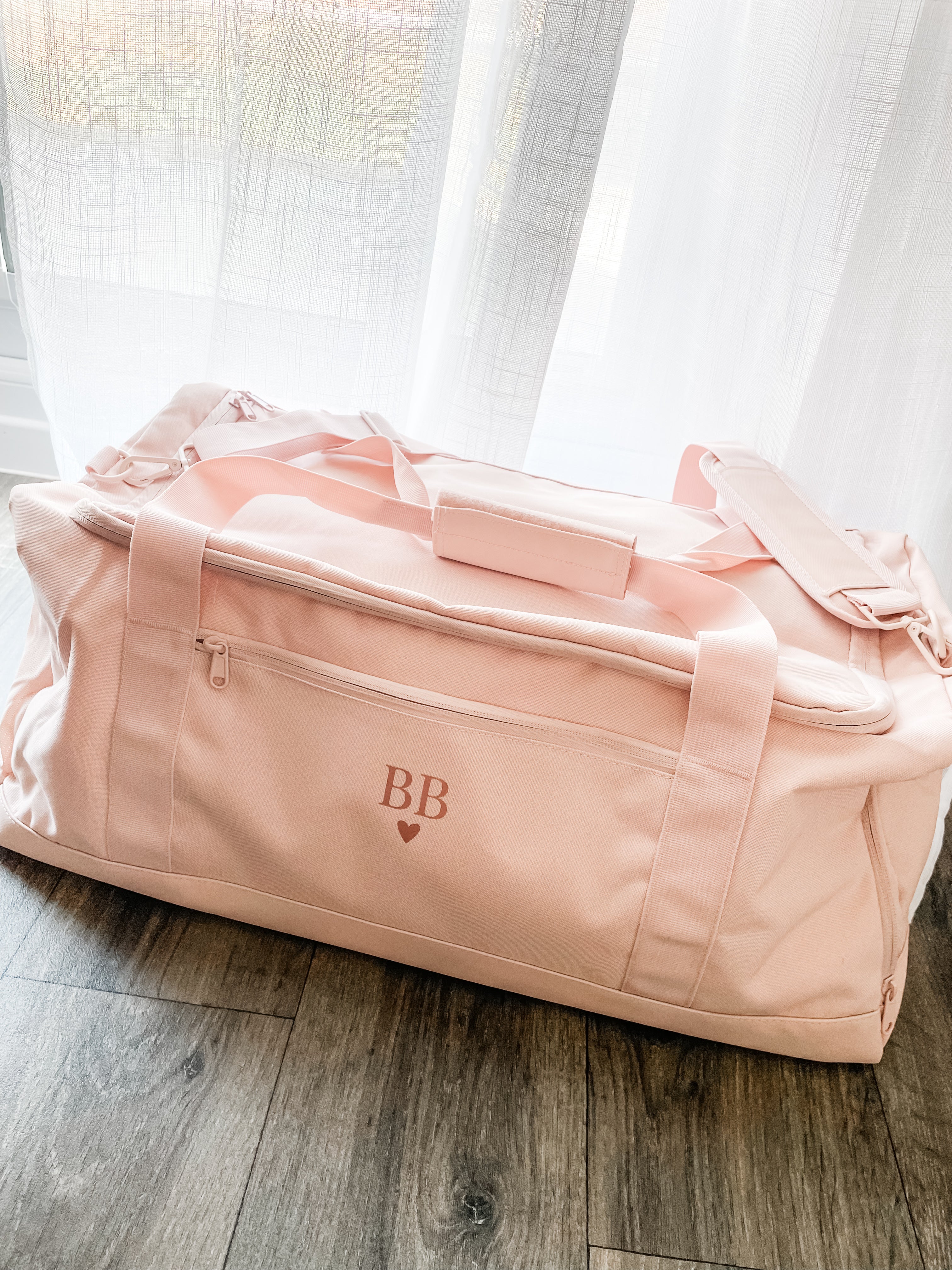 Personalised pink weekend travel bag with initials, stylish overnight holdall for holidays, trips and long weekends away. Personalised travel bag for her.