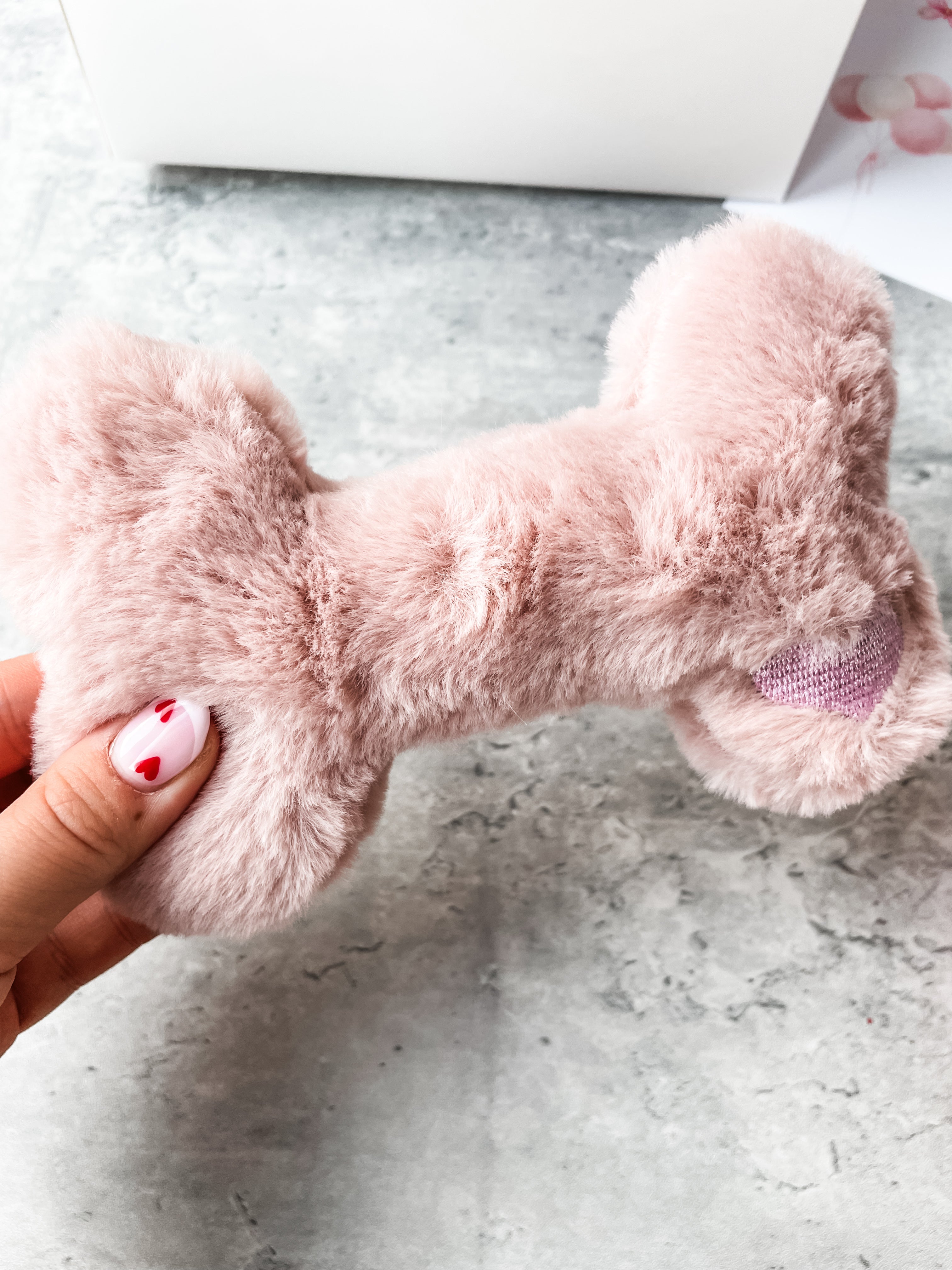 Soft plush bone dog toy included inside luxury personalised dog birthday hamper.